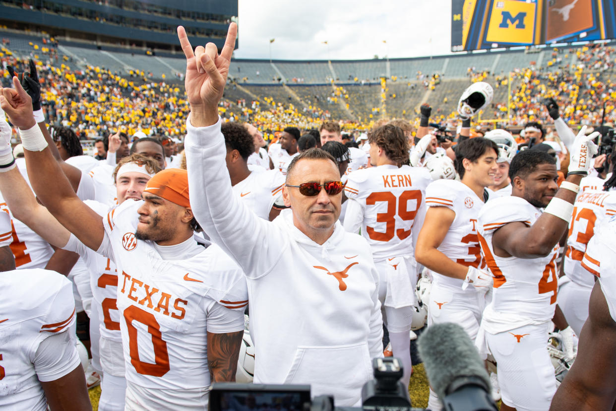 Texas coach Steve Sarkisian had plenty to celebrate about after the Longhorns trounced the Wolverines 31-12 on Saturday. (Aaron J. Thornton/Getty Images)