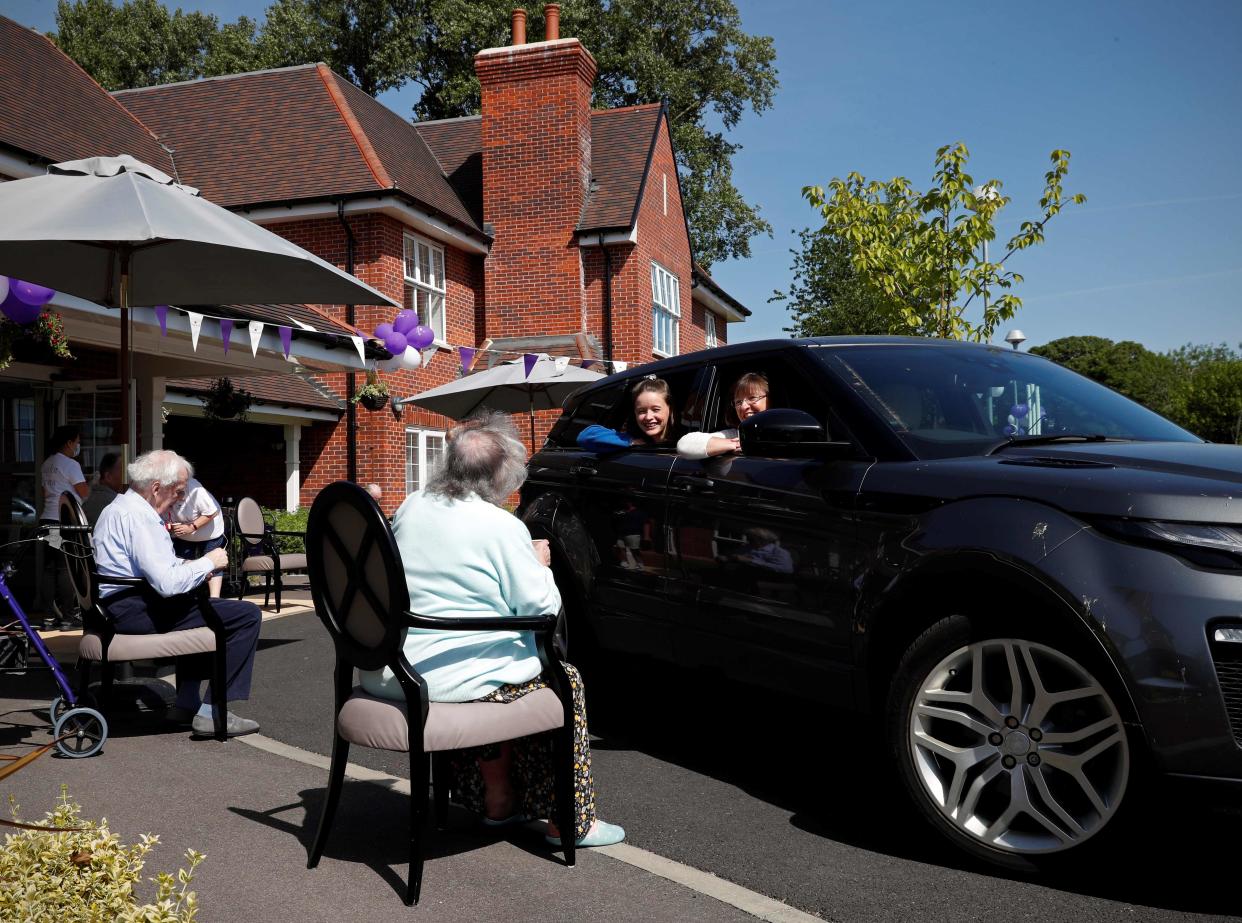 Socially distanced visit to care home (AFP/Getty)