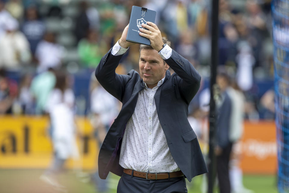 LA Galaxy head coach Greg Vanney applauds the fans after the Galaxy defeated Nashville SC in an MLS playoff soccer match, in Carson, Calif., Saturday, Oct. 15, 2022. (AP Photo/Alex Gallardo)