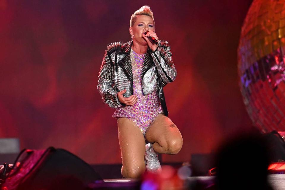 <p>Gilbert Flores/Billboard via Getty</p> Pink performing at her Summer Carnival tour in Los Angeles in October 2023
