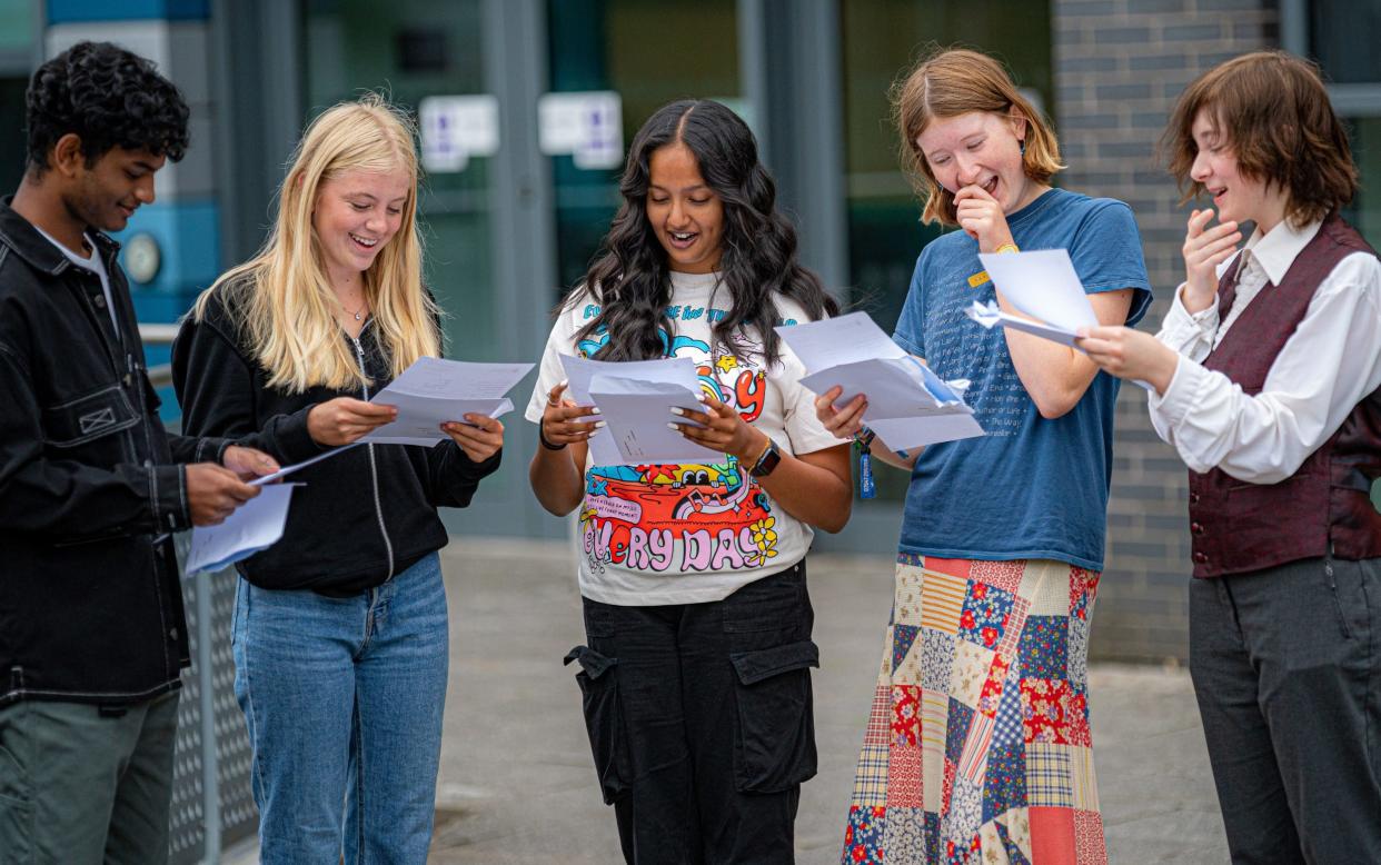 Pupils at a school in Bristol open their GCSE results in August this year - Ben Birchall/PA