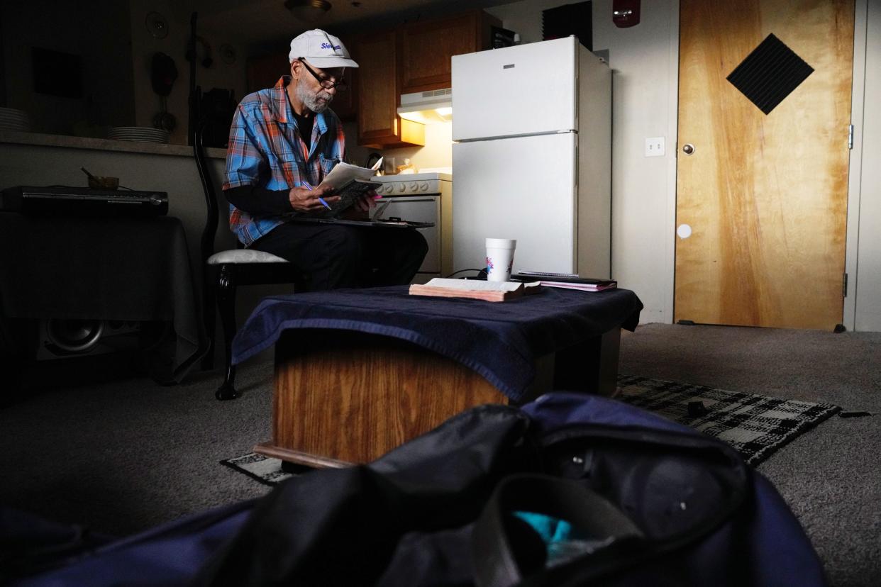 Rick Hammond sits in a chair, packing his belongings Thursday at Latitude Five25, 525 Sawyer Blvd., on Columbus' Near East Side. Residents began relocating Thursday morning to temporary housing due to a water main break. The duffel bag in front of him is all he's taking with him.