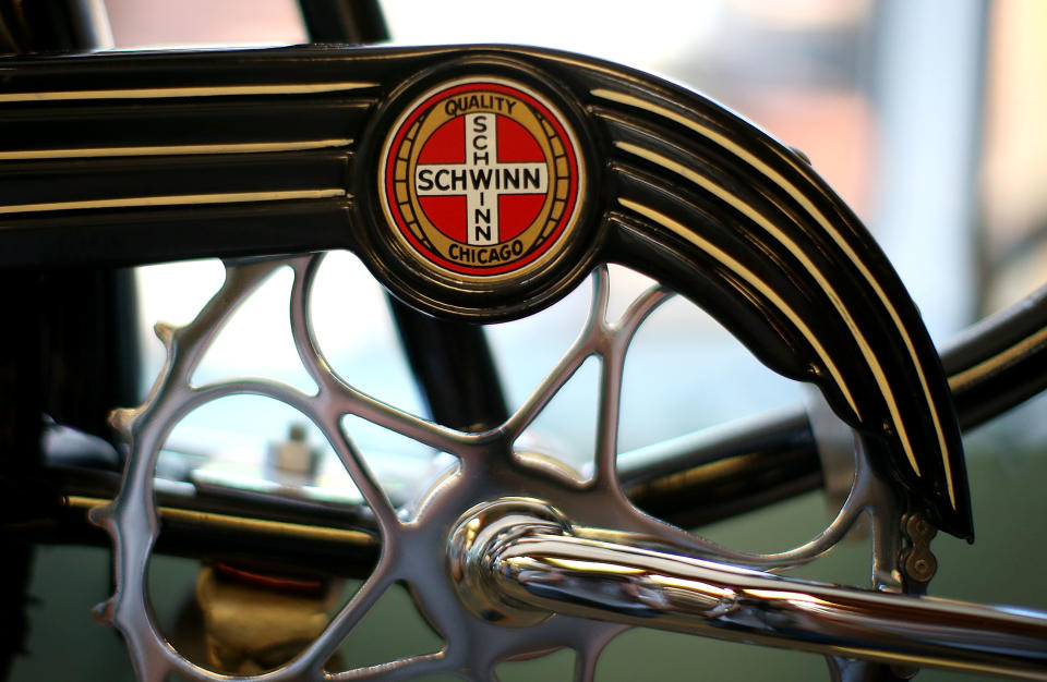 A Schwinn logo on a bicycle's main axle