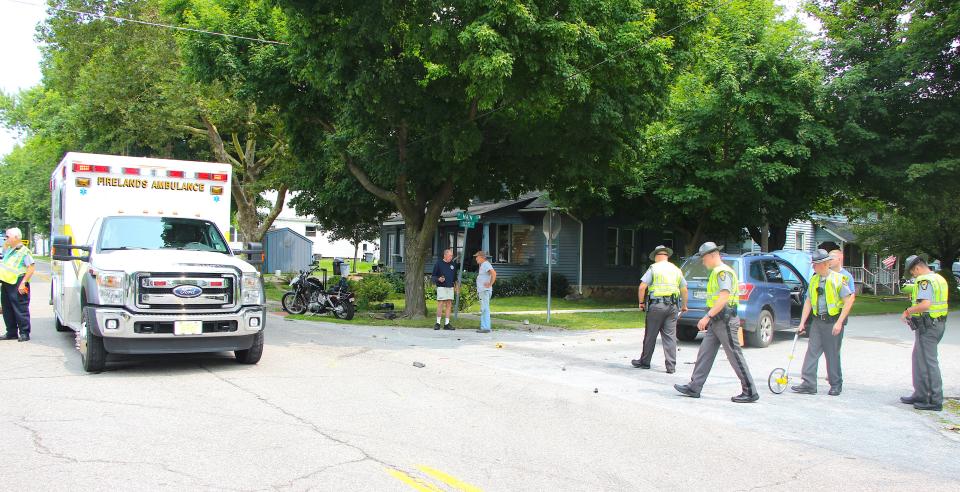 State Highway Patrol officers clear the scene of a fatal accident on state Route 545 in Ashland County.