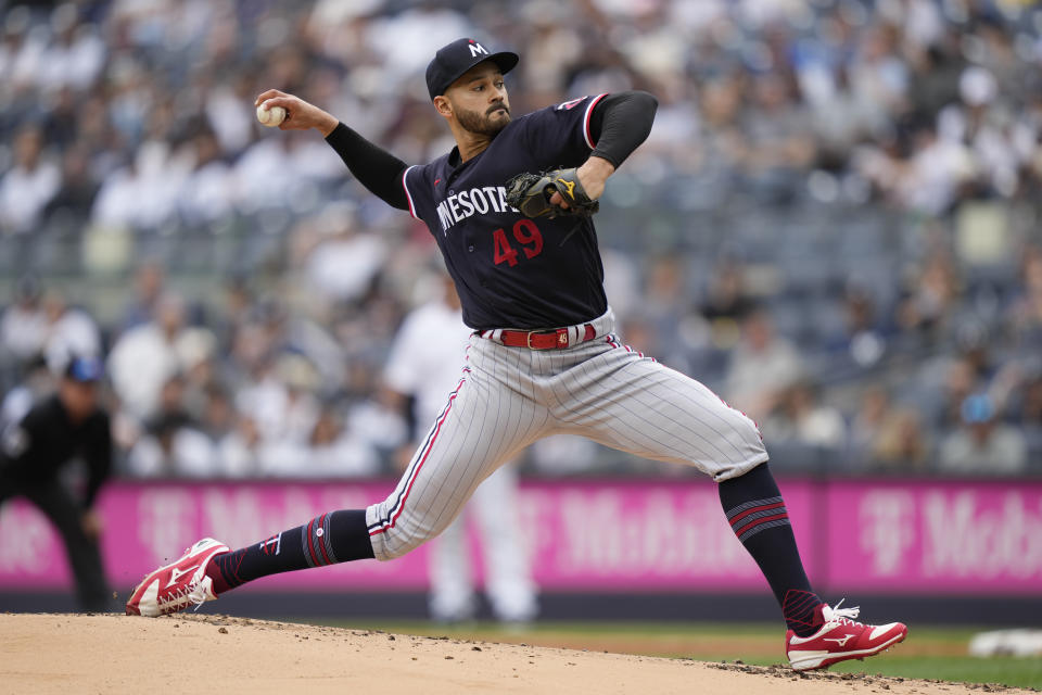 Minnesota Twins starting pitcher Pablo Lopez (49) throws in the first inning of a baseball game against the New York Yankees, Sunday, April 16, 2023, in New York. (AP Photo/John Minchillo)