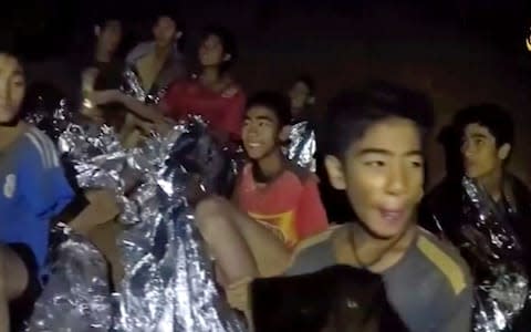 The Thai boys have appeared to be in good spirits in videos from the cave - Credit: HOGP/AP