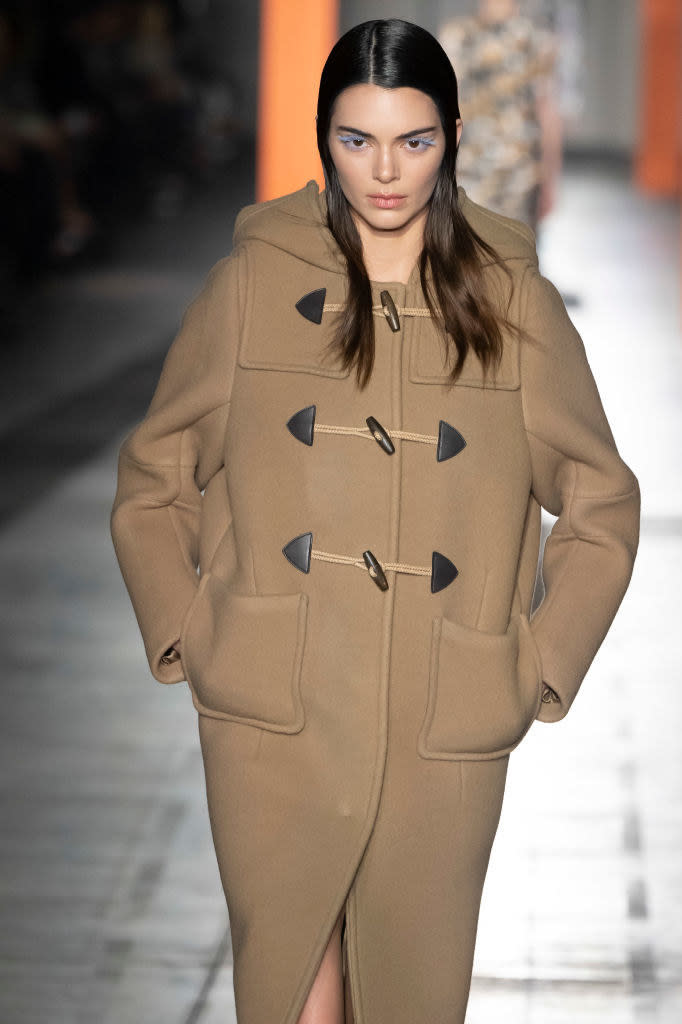 Kendall in a long duffle coat on the runway