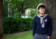 Simon Cheng, a former British Consulate employee, poses for a photograph in London