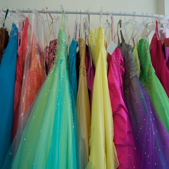 A rack of colorful prom dresses