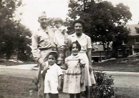 Robert and Marjorie Sanders and their three children in 1943.