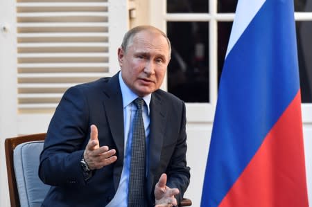 Russia's President Vladimir Putin meets with French President Emmanuel Macron at the French President's summer retreat of the Bregancon fortress on the Mediterranean coast, near the village of Bormes-les-Mimosas