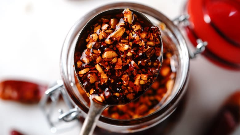 Spoonful of chili crisp over jar