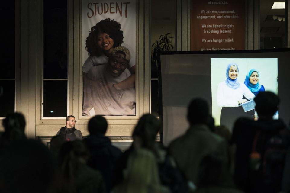 Loved ones speak during a vigil at the University of North Carolina following the murders of three Muslim students on February 11, 2015 in Chapel Hill, North Carolina. 