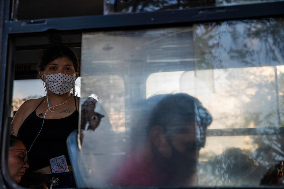 Workers, mostly from the tourism sector, on public transportation in downtown Cancún on Oct. 15. The drop in travel during the pandemic led to the disappearance of tens of thousands of tourism-sector jobs<span class="copyright">Claudia Guadarrama—Magnum Foundation for TIME</span>