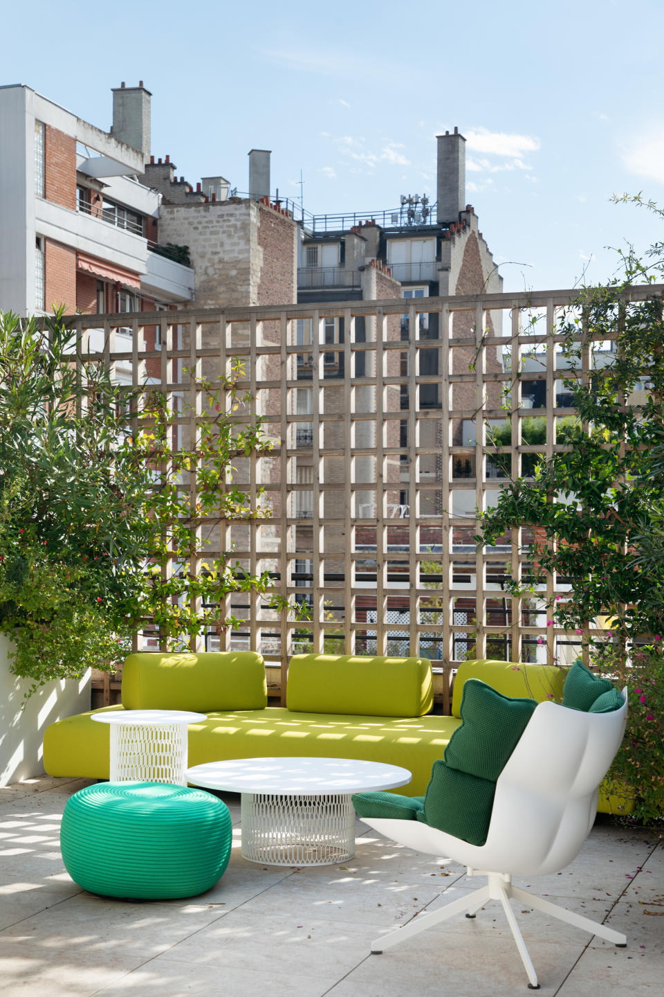 An outdoor space with bright toned furniture