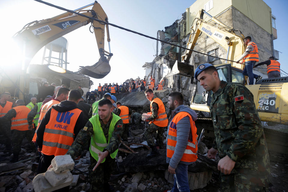 Emergency personnel work near a damaged building in Thumane, after an earthquake shook Albania, November 26, 2019. (Photo: Florion Goga/Reuters)