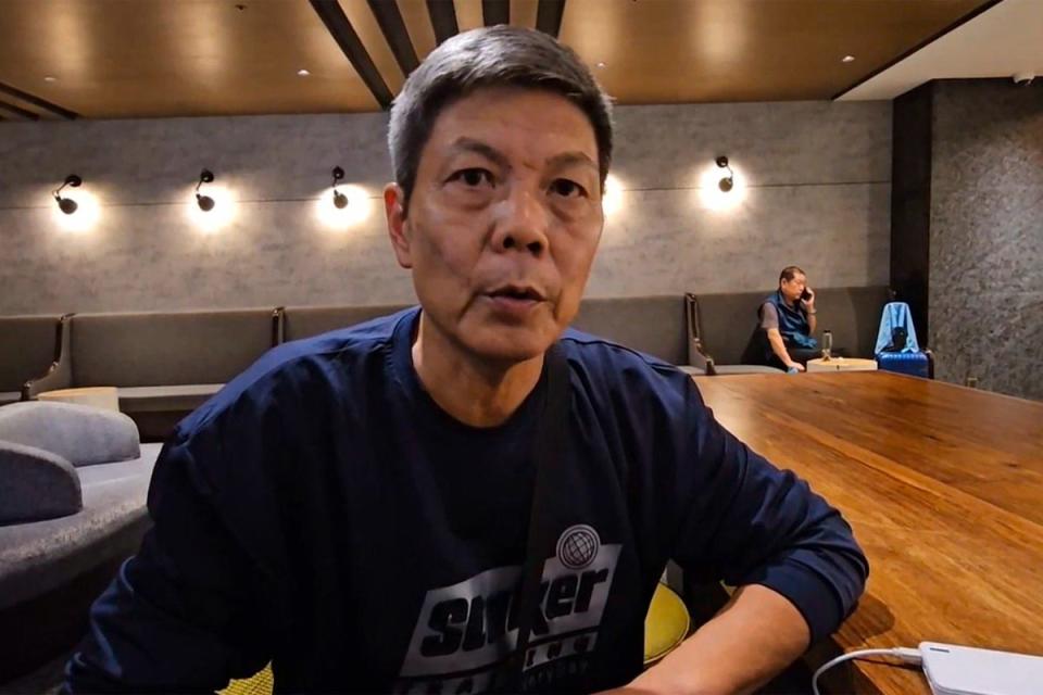 In this image taken from video footage run by TVBS, Chinese dissident Chen Siming speaks during an interview at Taoyuan International Airport’s transit lounge in Taipei on Friday (AP)