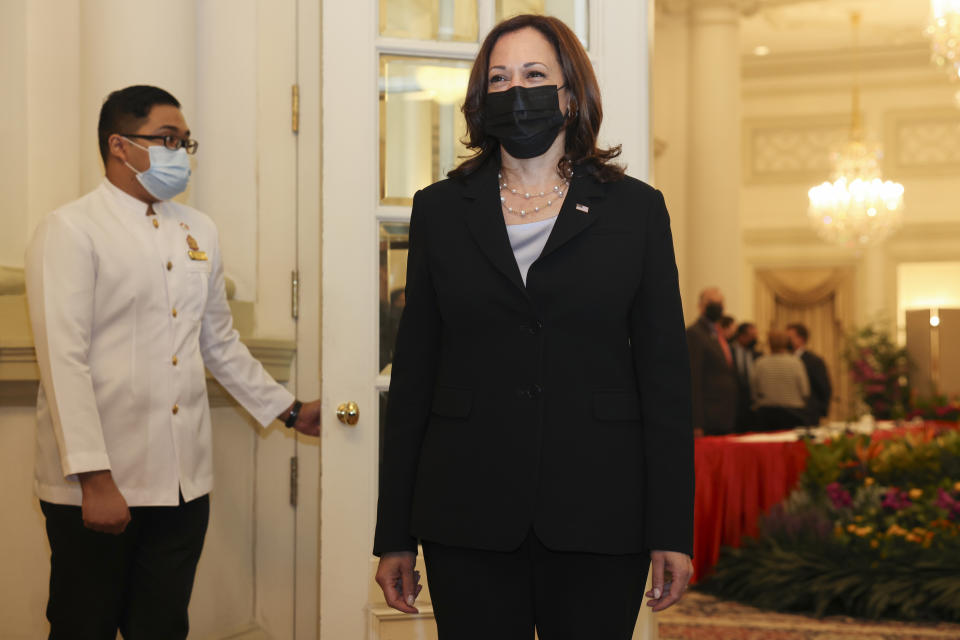 U.S. Vice President Kamala Harris, right, is pictured before a bilateral meeting with Singapore's Prime Minister Lee Hsien Loong at the Istana in Singapore Monday, Aug. 23, 2021. (Evelyn Hockstein/Pool Photo via AP)