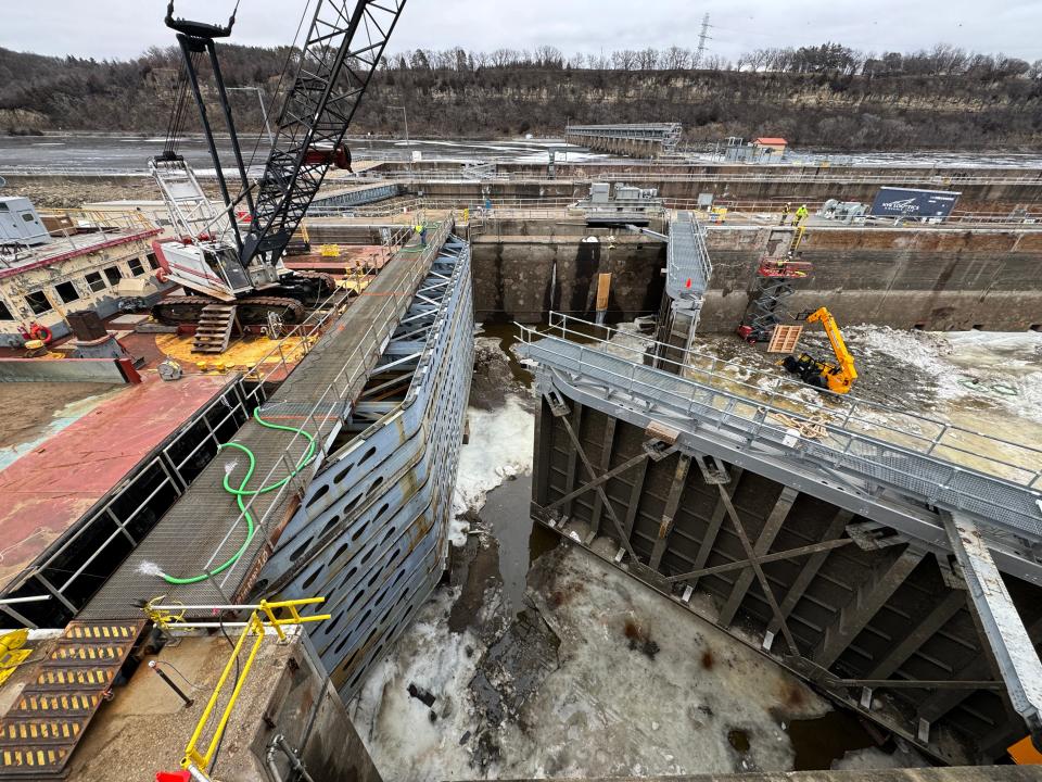 The bulkhead, left, prevents water from entering at Lock and Dam No. 2 so work can be done on the gates to the chamber, right, Jan. 30 on the Mississippi River in Hastings, Minnesota.