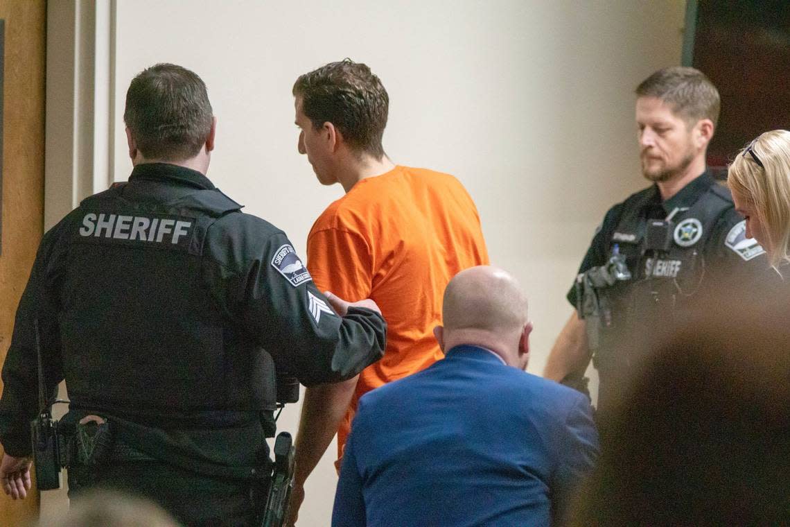 Bryan Kohberger is led out of Latah County District Court in Moscow after a status hearing on Jan. 12, 2023. Kohberger waived his right to a quick preliminary hearing, and is next scheduled to appear in court on June 26.