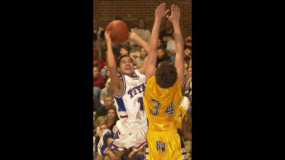 In this 2001 photo, Wichita South’s Shavis Tindall shoots over Northwest’s BJ Boockus. Tindall, a well-known person in Wichita’s basketball community, died on Jan. 15, 2024, in a home accident.