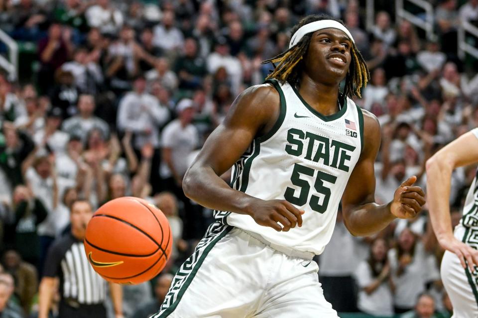 Michigan State's Coen Carr smiles after dunking against James Madison during the second half on Monday, Nov. 6, 2023, in East Lansing.