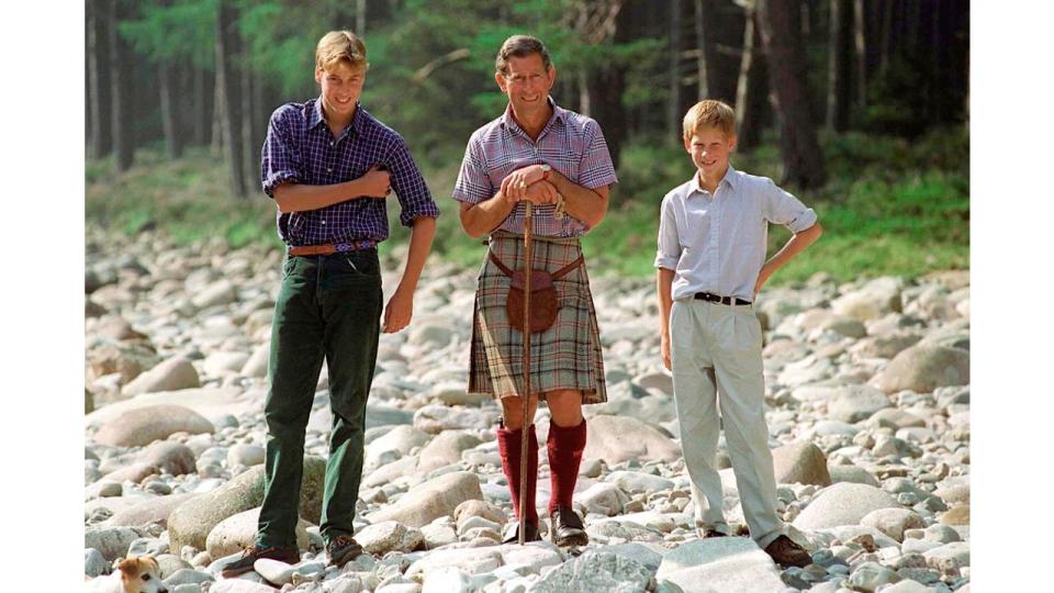 Charles wearing a kilt with Harry and William in Scotland in 1997