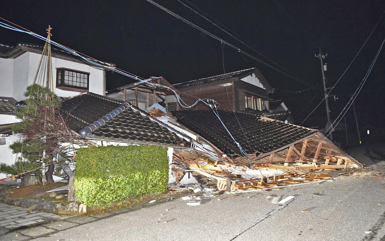 Collapsed houses after an earthquake in Anamizu Town in Japan's Ishikawa Prefecture on Jan. 1, 2024.  (Noboru Hosono / The Yomiuri Shimbun via AP)