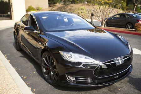 FILE PHOTO: A Tesla Model S with version 7.0 software update containing Autopilot features is seen during a Tesla event in Palo Alto, California October 14, 2015. REUTERS/Beck Diefenbach/File Photo