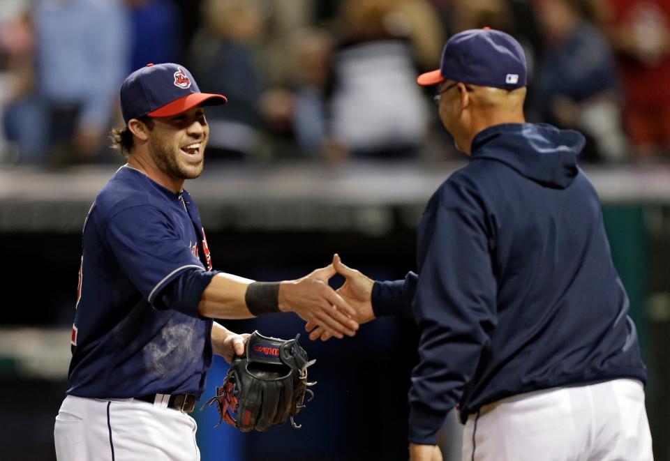 Cleveland's Jason Kipnis, left, is congratulated by manager Terry Francona after a 4-3 win over the Kansas City Royals on Tuesday, June 18, 2013, in Cleveland. Kipnis' RBI double in the eighth tied the score.
