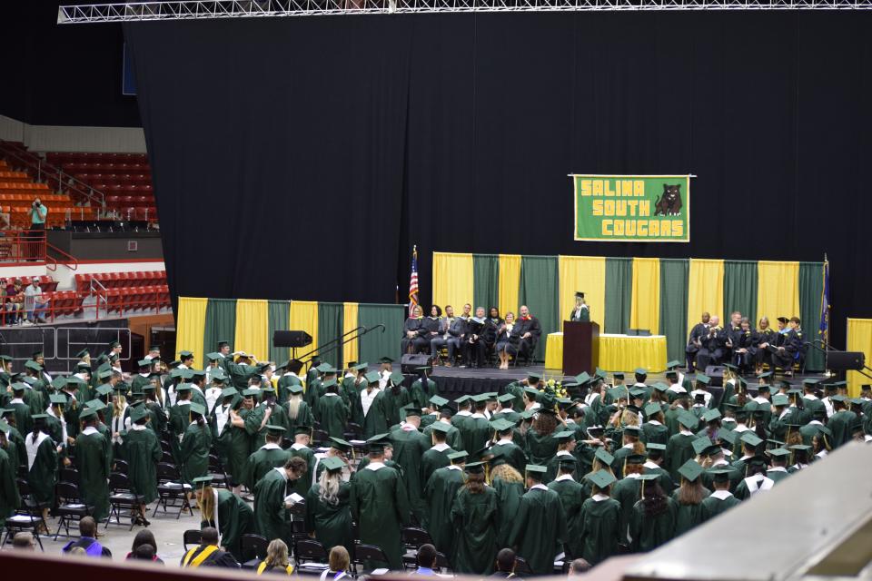 The 2022 Salina South High School graduates celebrate at the end of their commencement ceremony. The class also threw confetti into the air after moving their tassels from right to left.