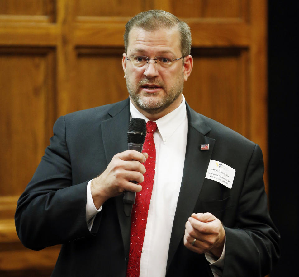In this March 23, 2017, photo, Democrat James Thompson, a candidate for Kansas' 4th Congressional District, speaks during a debate in Wichita, Kan. President Donald Trump stepped into a surprisingly competitive special congressional election in Kansas Monday, April 10, 2017, recording a get-out-the-vote call on behalf of Republican candidate Ron Estes. Thompson, is spending the final day of campaigning before Tuesday's election talking directly to voters. It was the first special congressional election since Trump's election as president last year. (Bo Rader/Wichita Eagle via AP)