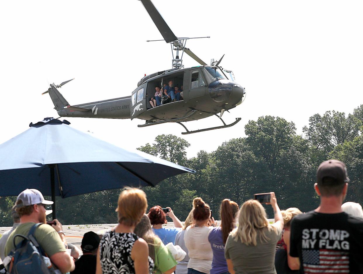 The UH-1 Huey Greyhound from the Yankee Air Museum returns and lands with a group of passengers at the ninth annual Ashland County Veterans Appreciation Day at the Ashland County Airport on Saturday, Aug. 6, 2022. TOM E. PUSKAR/ASHLAND TIMES-GAZETTE