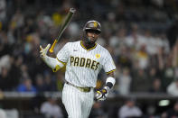 San Diego Padres' Jurickson Profar tosses his bat after hitting a two-run home run during the sixth inning of a baseball game against the Colorado Rockies, Monday, May 13, 2024, in San Diego. (AP Photo/Gregory Bull)