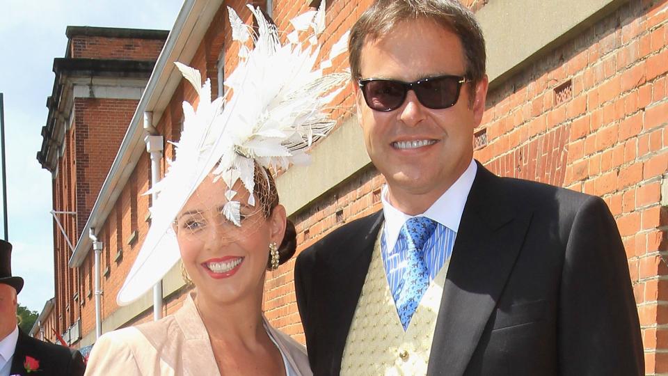Peter Jones in a morning suit with girlfriend Tara Capp in a white dress and feathered hat