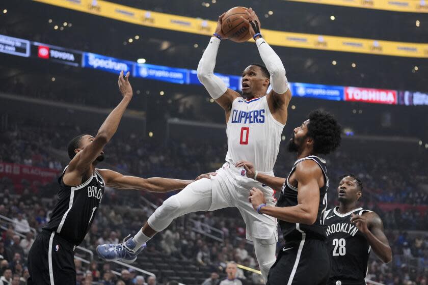 Los Angeles Clippers guard Russell Westbrook (0) dives to the basket against the Brooklyn Nets during the first half of an NBA basketball game Sunday, Jan. 21, 2024, in Los Angeles. (AP Photo/Marcio Jose Sanchez)