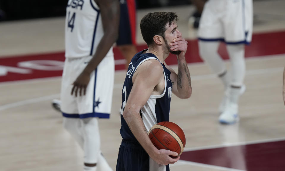 France's Nando de Colo (12) reacts during men's basketball gold medal game against the United States at the 2020 Summer Olympics, Saturday, Aug. 7, 2021, in Saitama, Japan. (AP Photo/Luca Bruno)