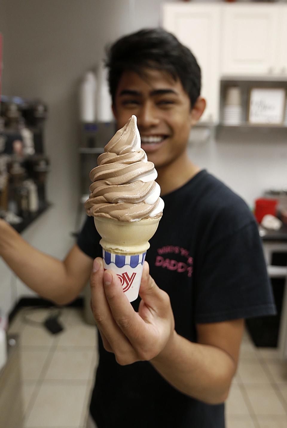 Chai Sriakkharahad makes a soft serve ice cream at Daddy's Dairy in Stoughton on Monday, June 18, 2018. Dave DeMelia/The Enterprise