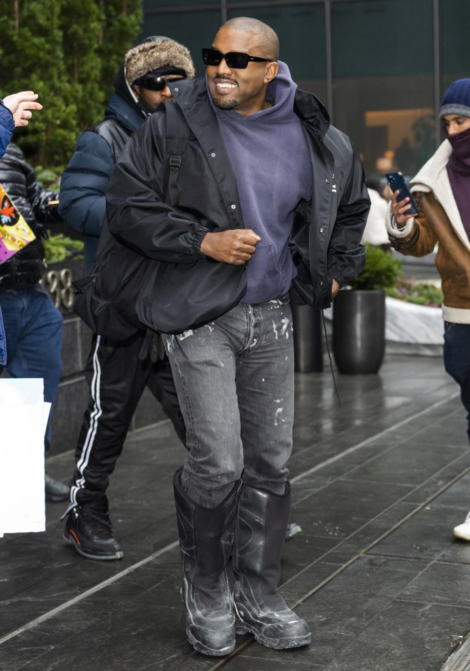 <p>Kanye West steps out with a smile in New York City on Jan. 5.</p>