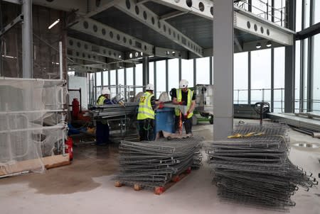 Workers are seen at the construction site of 22 Bishopsgate in London