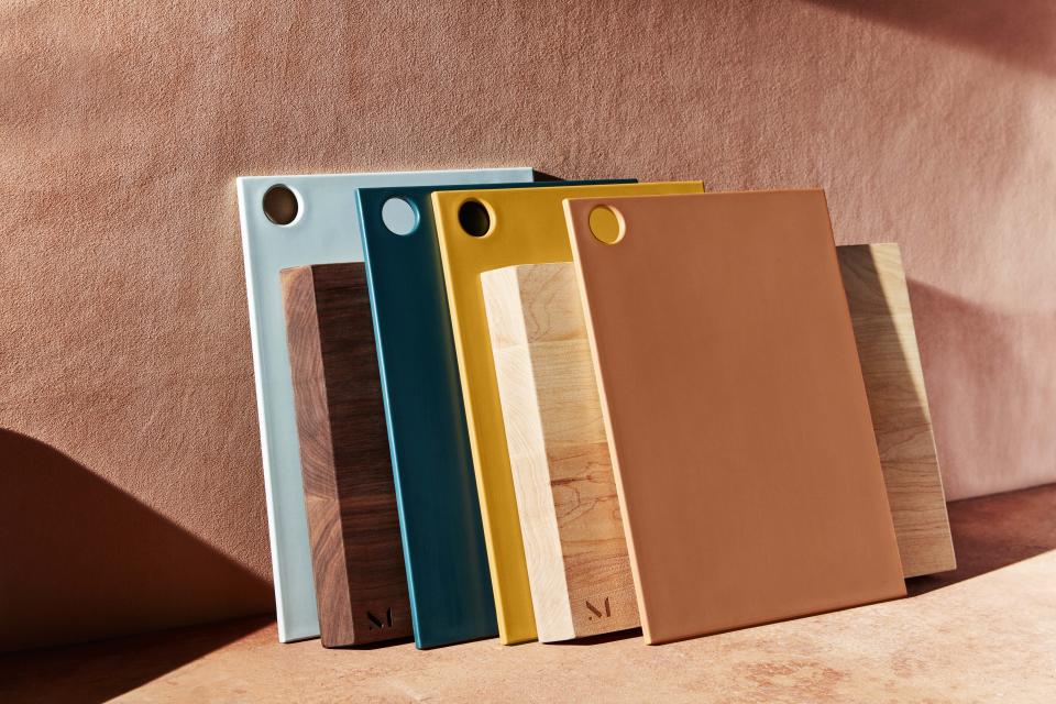 This undated photo provided by Material shows their reBoard cutting boards which are made of recycled plastic and renewable sugarcane. The warm palette includes a range of earth tones, including a terracotta-hued coral. (Material via AP)