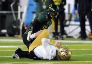 EUGENE, OR - DECEMBER 02 : Defensive end Dion Jordan #96 of the Oregon Ducks looks over at quarterback Kevin Prince #4 of the UCLA Bruins after sacking him in the second quarter of the Pac-12 Championship game at Autzen Stadium on December 2, 2011 in Eugene, Oregon. (Photo by Steve Dykes/Getty Images)