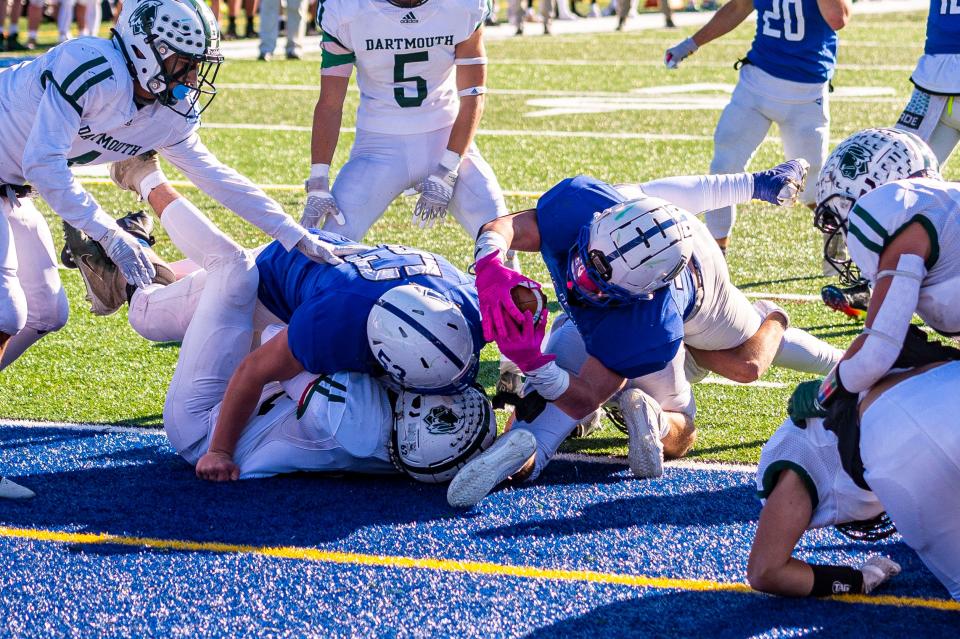 Fairhaven's Justin Marques dives ahead for the touchdown.
