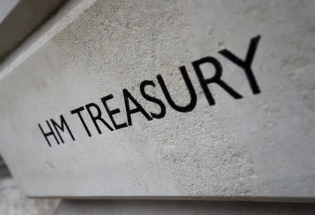 FILE PHOTO: The HM Treasury name is seen painted on the outside of Britain's Treasury building in central London