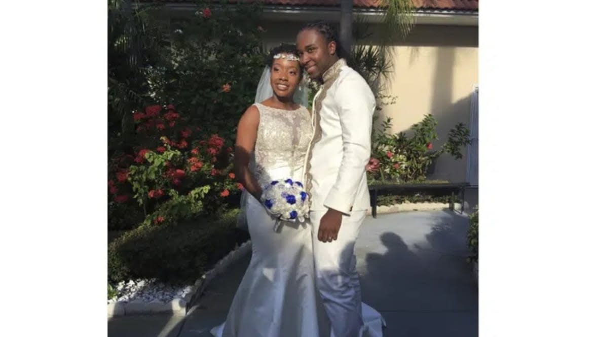In this Nov. 9, 2018 photo provided by Nikese Toussaint, Jean-Dickens Toussaint and his wife, Abigail Michael Toussaint, pose for a photo at their wedding in Pompano Beach, Florida. Nikese Toussaint says that gangs in Haiti kidnapped the couple and a third person traveling with them on March 18, and that the gang is demanding $200,000 for each person. (Photo: Nikese Toussaint via AP)