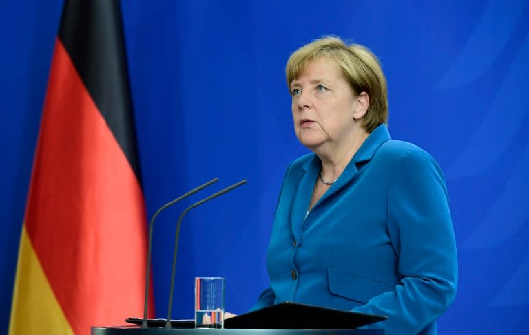 Chancellor Angela Merkel faces criticism from political rivals who blame her liberal asylum policy for the recent spate of attacks in Germany