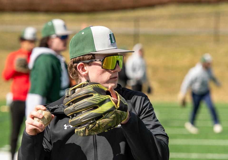 Oakmont's Caleb Allen and the rest of the baseball team warm up on the first day of practice Monday, March 18, 2024.