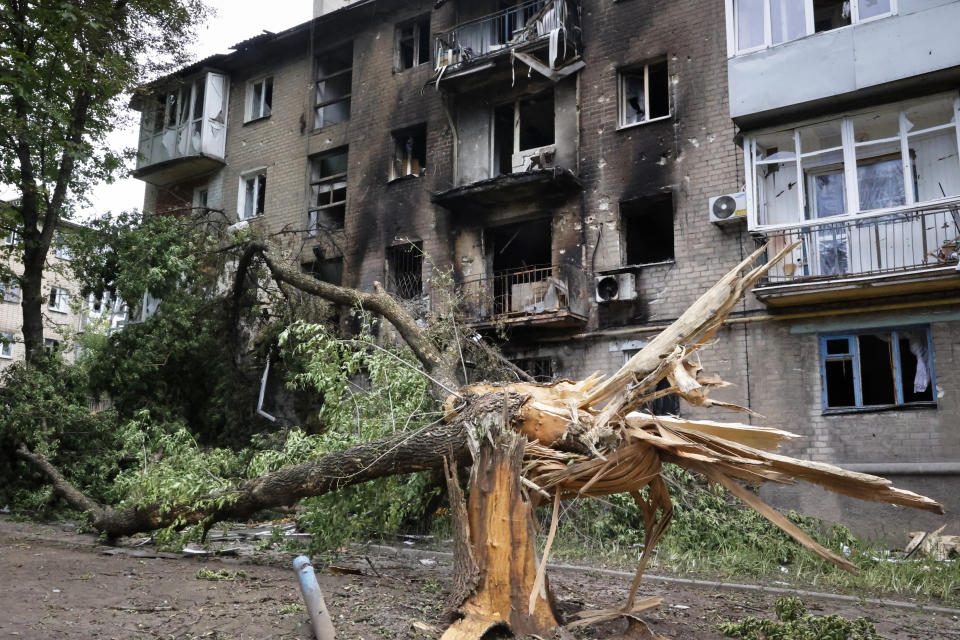 A view of an apartment building damaged during shelling in Donetsk, in territory under the government of the Donetsk People's Republic, eastern Ukraine, Wednesday, June 22, 2022. (AP Photo/Alexei Alexandrov)
