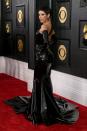 <p>At the Grammys last year, Doja Cat's look, a Versace gown accessorized with a glass Coperni bag, broke the Internet for quite literally looking like it could break. This year, she said she's debuting a "new era" that's everything but fragile. Her first look of the night was <a href="https://www.harpersbazaar.com/celebrity/latest/a42672904/doja-cat-red-carpet-grammys-2023/" rel="nofollow noopener" target="_blank" data-ylk="slk:a black latex Versace gown;elm:context_link;itc:0;sec:content-canvas" class="link ">a black latex Versace gown</a> with an asymmetrical strap twisted around her back like a loose braid, styled with matching gloves and tentacle-like hoop earrings. She looked gusty and menacing and spunky, much like the tarantula that's currently her Instagram profile picture. </p>