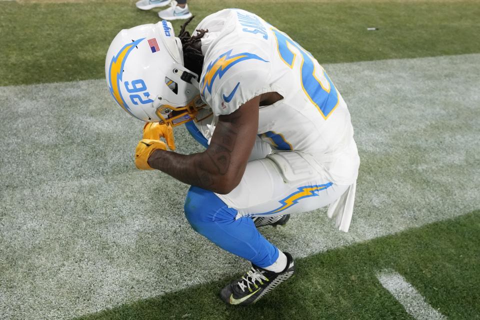 Los Angeles Chargers cornerback Asante Samuel Jr. (26) takes a moment after an NFL wild-card football game against the Jacksonville Jaguars, Saturday, Jan. 14, 2023, in Jacksonville, Fla. Jacksonville Jaguars won 31-30. (AP Photo/Chris O'Meara)